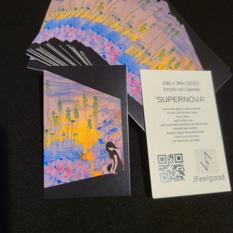 Colorful art prints arranged on a black surface, alongside an event card with details.