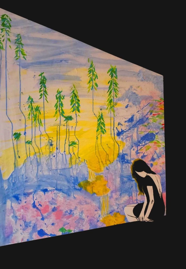 A person sitting beside a colorful, abstract landscape with trees and flowing colors.